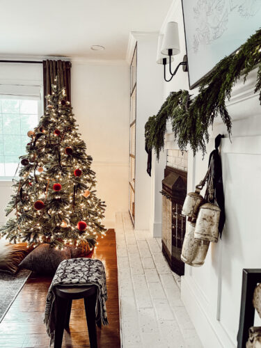 Cozy fireplace mantel decorations that are easy and simple to do! Moody christmas mantel accents, fireplace mantel decorations for the holidays! #christmasmanteldecor #christmasmantle #cozyfireplace