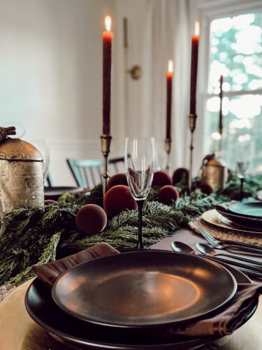 A holiday tablescape using red, brown and green #christmastablescape #christmastabledecorations #holidaytablescape #marlydiceblog