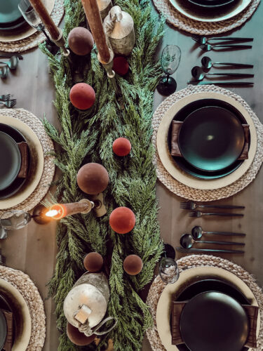A holiday tablescape using red, brown and green #christmastablescape #christmastabledecorations #holidaytablescape #marlydiceblog