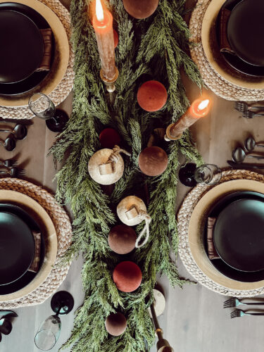 A holiday tablescape using red, brown and green #christmastablescape #christmastabledecorations #holidaytablescape #marlydiceblog