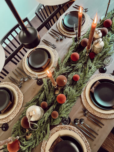 A holiday tablescape using red, brown and green #christmastablescape #christmastabledecorations #holidaytablescape #marlydiceblog