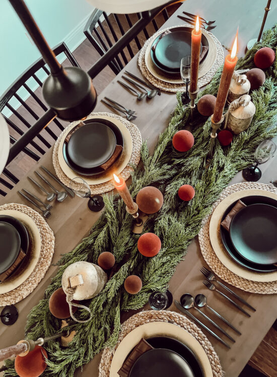 A holiday tablescape using red, brown and green #christmastablescape #christmastabledecorations #holidaytablescape #marlydiceblog