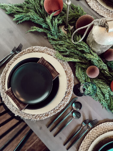 A holiday tablescape using red, brown and green #christmastablescape #christmastabledecorations #holidaytablescape #marlydiceblog