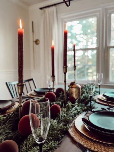 A holiday tablescape using red, brown and green #christmastablescape #christmastabledecorations #holidaytablescape #marlydiceblog