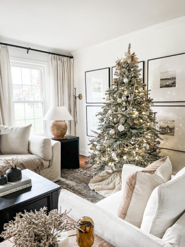 Flocked Christmas tree and neutral Christmas tree decor in our sitting room! #neutralchristmasdecor #neutralchristmastree