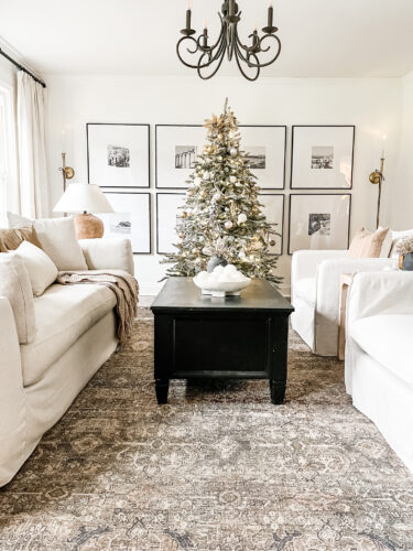 Flocked Christmas tree and neutral Christmas tree decor in our sitting room! #neutralchristmasdecor #neutralchristmastree