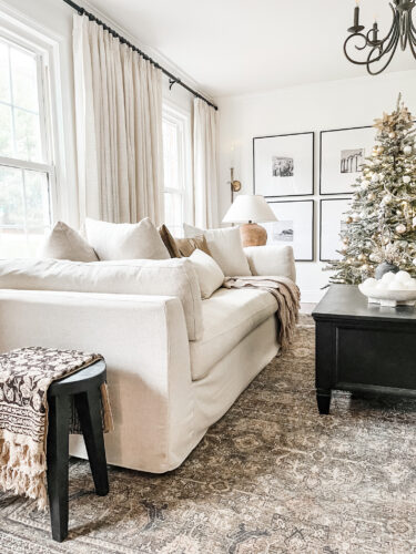 Flocked Christmas tree and neutral Christmas tree decor in our sitting room! #neutralchristmasdecor #neutralchristmastree