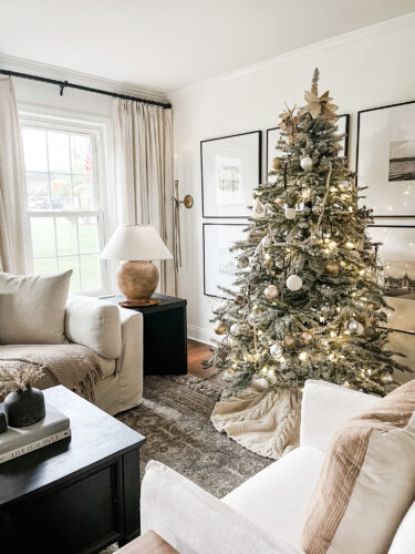 Flocked Christmas tree and neutral Christmas tree decor in our sitting room! #neutralchristmasdecor #neutralchristmastree