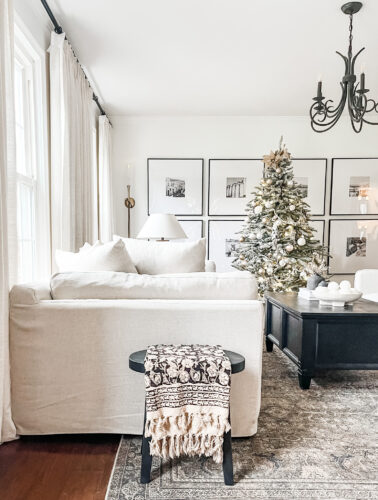 Flocked Christmas tree and neutral Christmas tree decor in our sitting room! #neutralchristmasdecor #neutralchristmastree