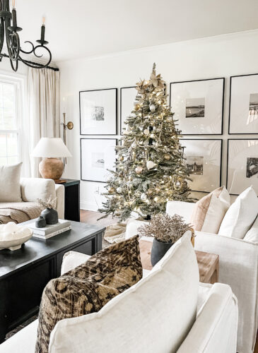 Flocked Christmas tree and neutral Christmas tree decor in our sitting room! #neutralchristmasdecor #neutralchristmastree