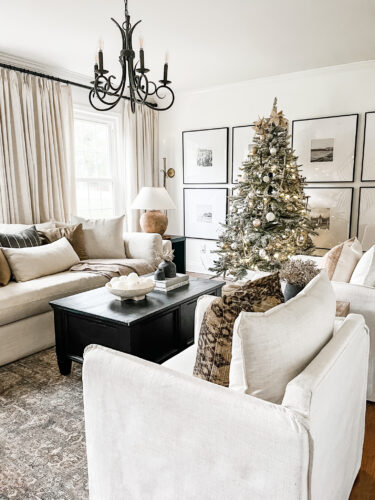 Flocked Christmas tree and neutral Christmas tree decor in our sitting room! #neutralchristmasdecor #neutralchristmastree