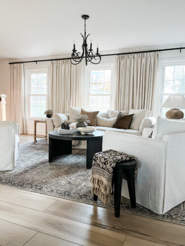 How to layout a living room with a round coffee table, black round coffee table, elegant living room #roundcoffeetable