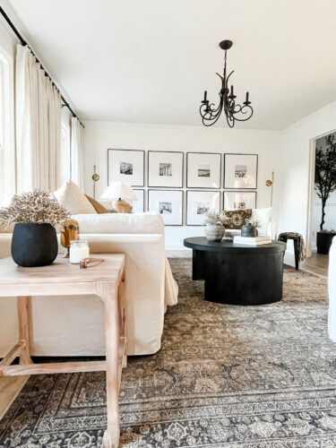 How to layout a living room with a round coffee table, black round coffee table, elegant living room #roundcoffeetable