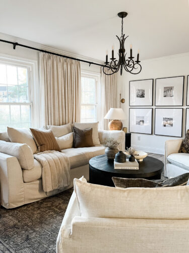 How to layout a living room with a round coffee table, black round coffee table, elegant living room #roundcoffeetable