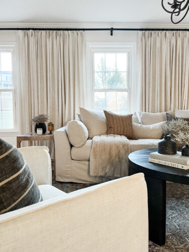 How to layout a living room with a round coffee table, black round coffee table, elegant living room #roundcoffeetable