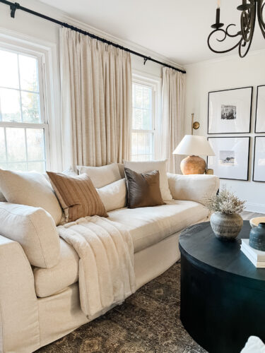 How to layout a living room with a round coffee table, black round coffee table, elegant living room #roundcoffeetable