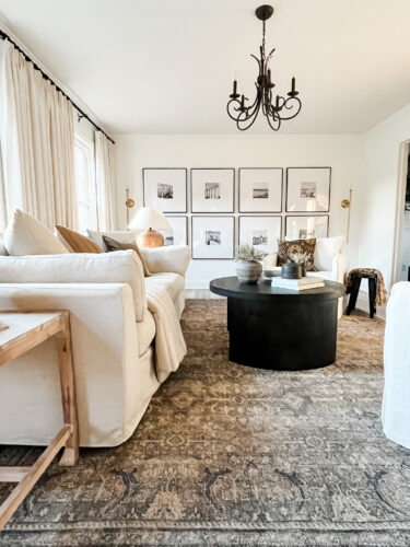 How to layout a living room with a round coffee table, black round coffee table, elegant living room #roundcoffeetable