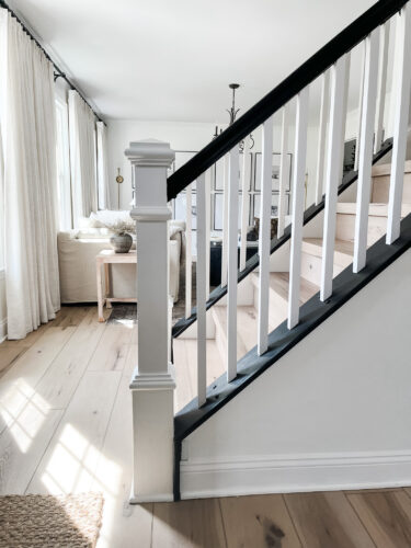 DIY Staircase Makeover using LVP flooring and paint! See the before and after plus a video!