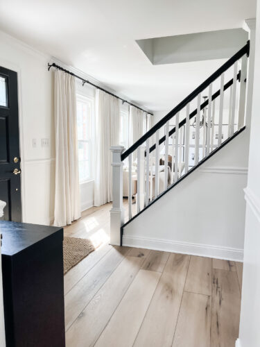 DIY Staircase Makeover using LVP flooring and paint! See the before and after plus a video!
