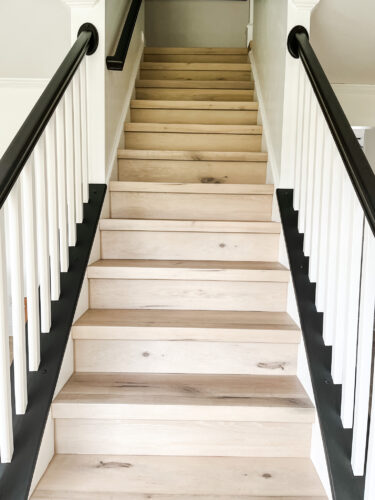 DIY Staircase Makeover using LVP flooring and paint! See the before and after plus a video!