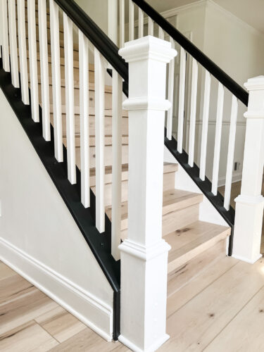 DIY Staircase Makeover using LVP flooring and paint! See the before and after plus a video!