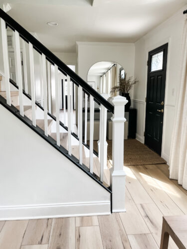 DIY Staircase Makeover using LVP flooring and paint! See the before and after plus a video!