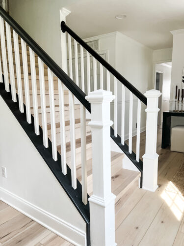 DIY Staircase Makeover using LVP flooring and paint! See the before and after plus a video!