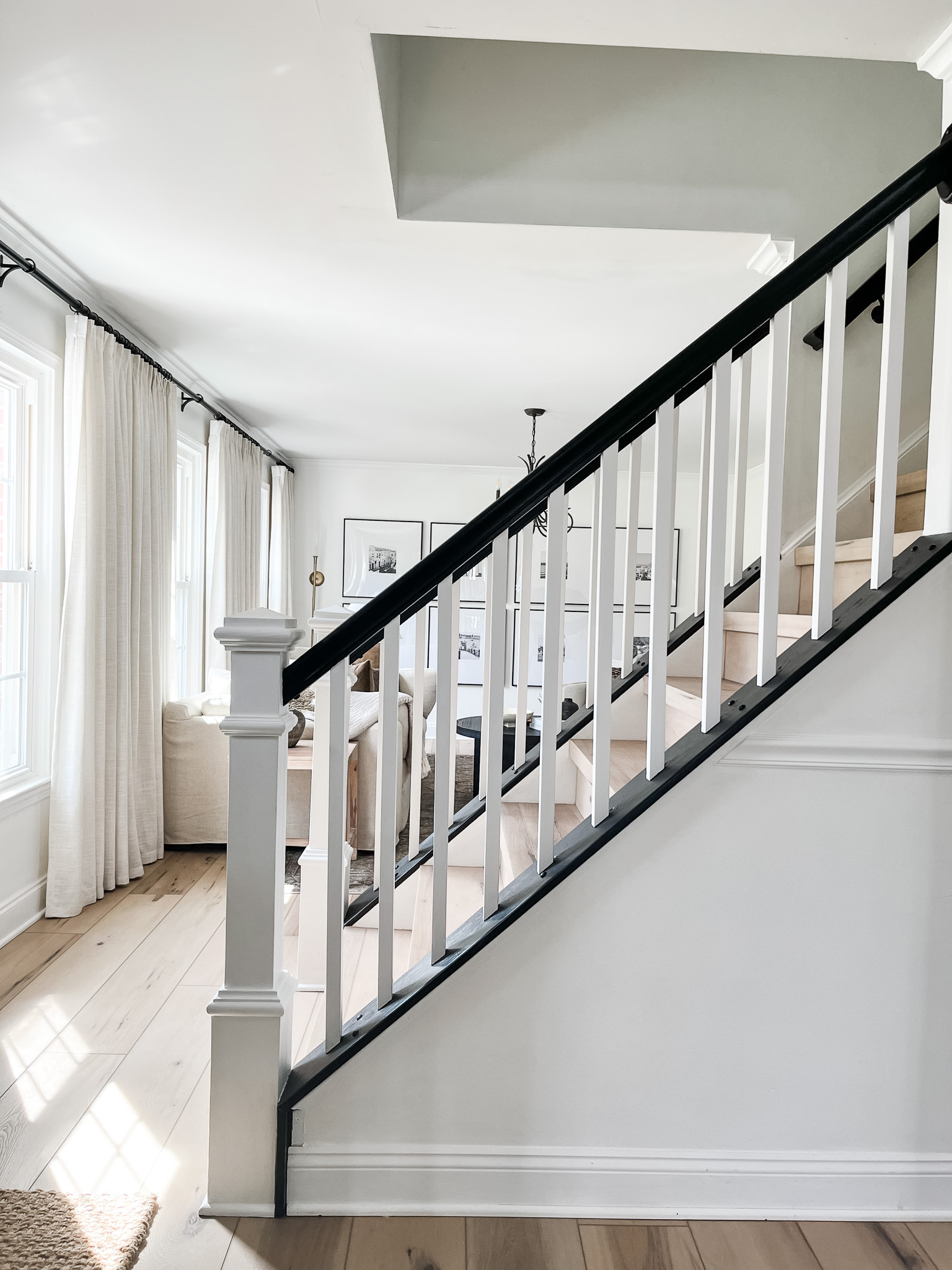 DIY Staircase Makeover using LVP flooring and paint! See the before and after plus a video!