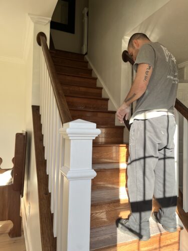 DIY Staircase Makeover using LVP flooring and paint! See the before and after plus a video!