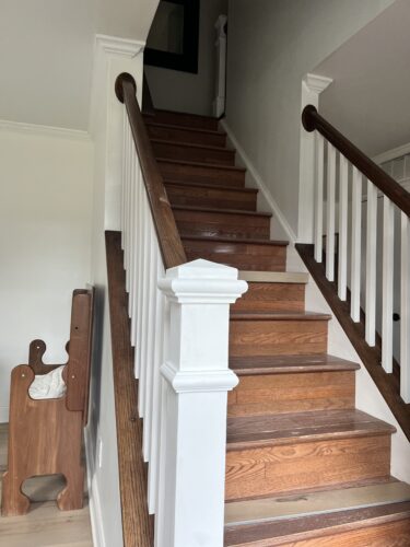DIY Staircase Makeover using LVP flooring and paint! See the before and after plus a video!