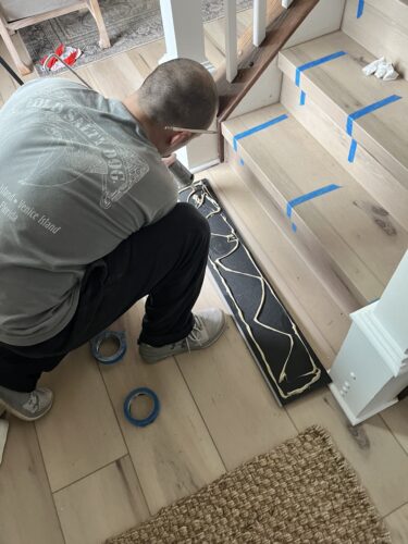 DIY Staircase Makeover using LVP flooring and paint! See the before and after plus a video!