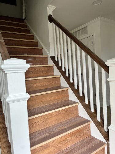 DIY Staircase Makeover using LVP flooring and paint! See the before and after plus a video!