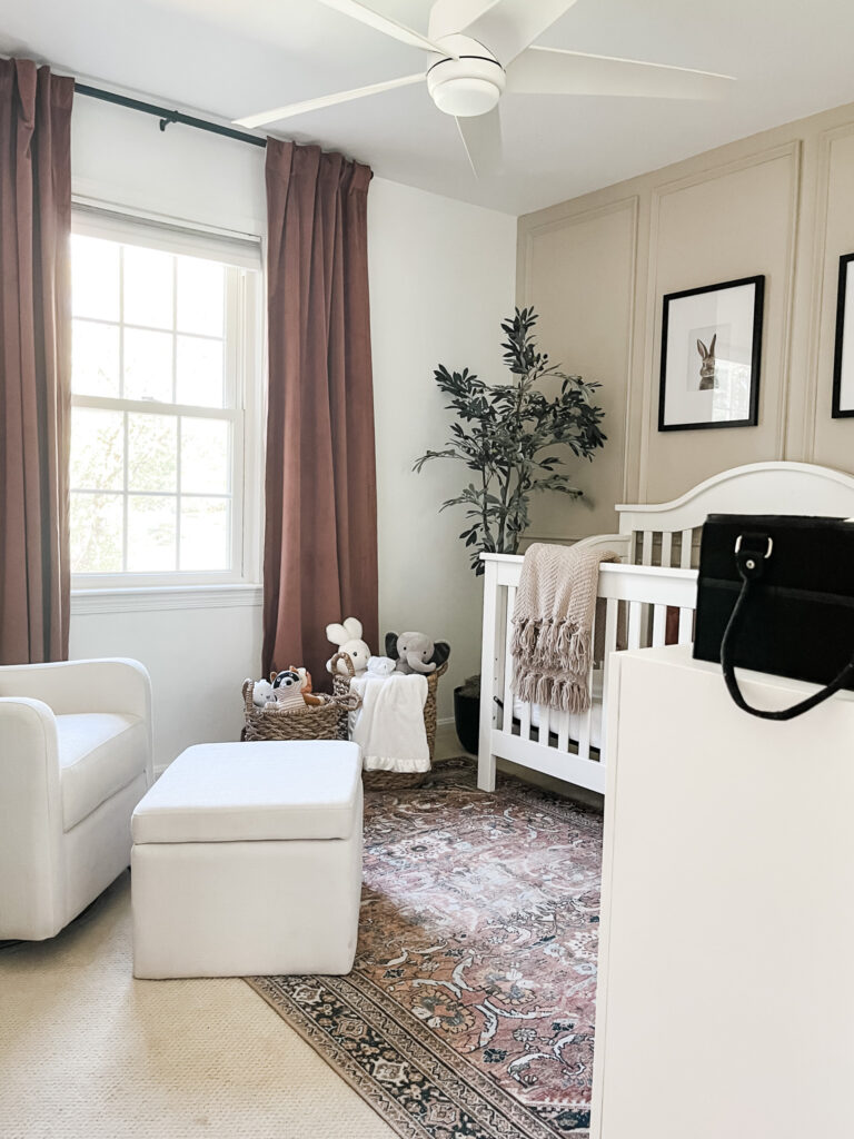 Ideas for a neutral baby girl nursery with rose colored accents