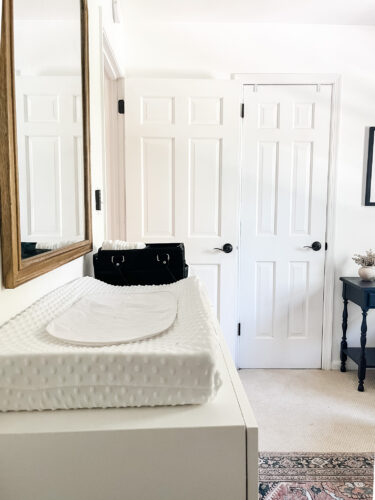 Ideas for a neutral baby girl nursery with rose colored accents