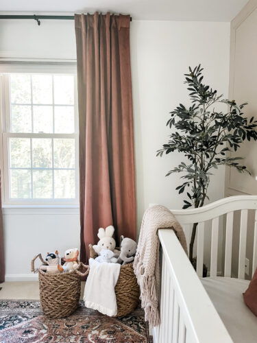 Ideas for a neutral baby girl nursery with rose colored accents