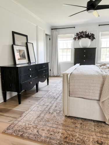 Black and white transitional bedroom with neutral bed & decor, Sophisticated modern bedroom ideas