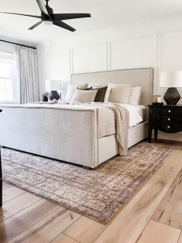 Black and white transitional bedroom with neutral bed & decor, Sophisticated modern bedroom ideas