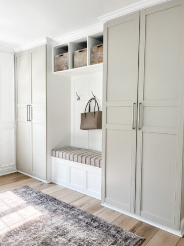 Functional mudroom ideas + picture frame moulding addition in our mudroom entryway.