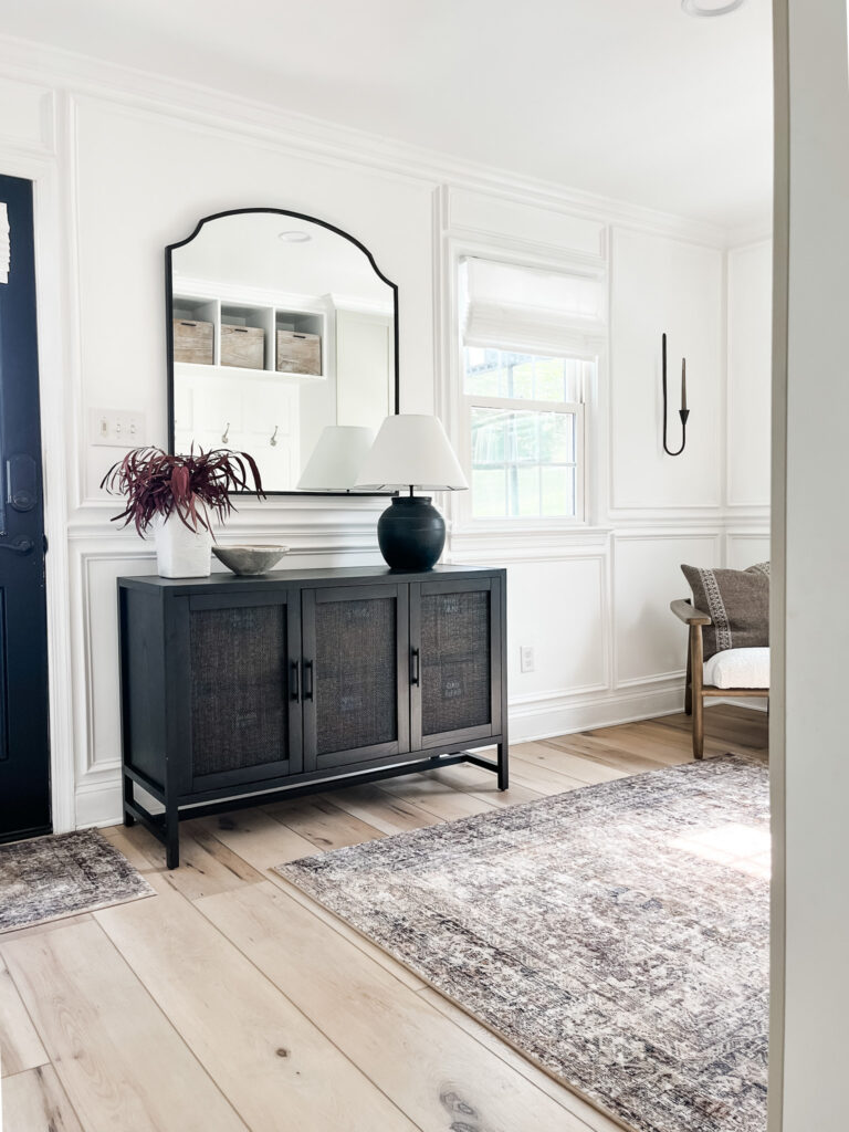 Functional mudroom ideas + picture frame moulding addition in our mudroom entryway.