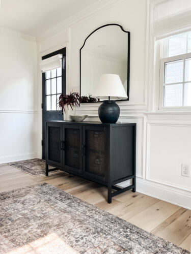 Functional mudroom ideas + picture frame moulding addition in our mudroom entryway.