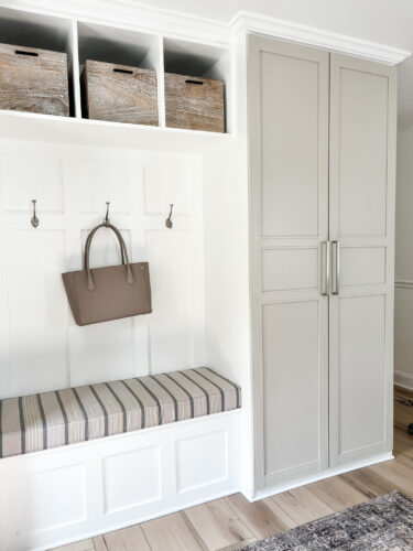 Functional mudroom ideas + picture frame moulding addition in our mudroom entryway.
