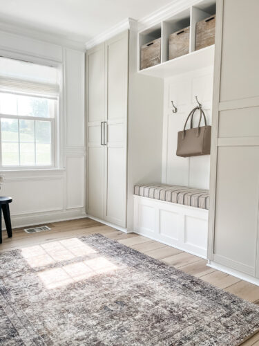 Functional mudroom ideas + picture frame moulding addition in our mudroom entryway.