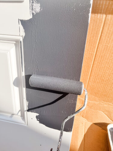 Rolling paint on our new front door from Pease Doors